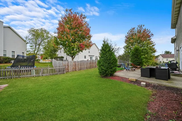 a view of a chair and table and chairs in the garden