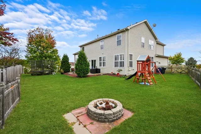 a view of a backyard with plants and a garden