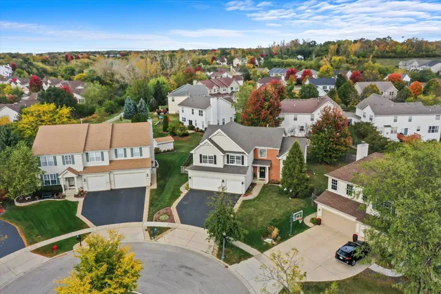 an aerial view of a house with a garden