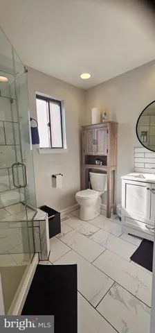 a kitchen with stainless steel appliances a stove a sink and a refrigerator