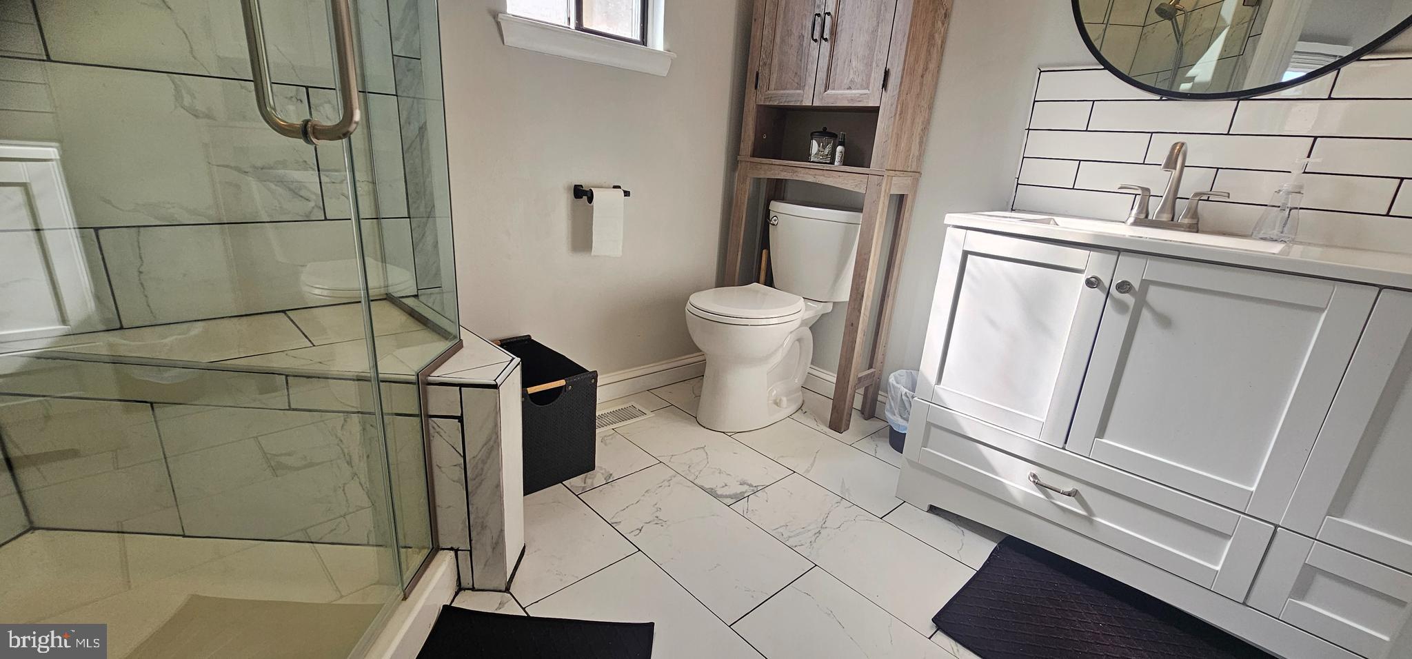 605 Augusta Circle Mount Laurel, NJ 08054 - Photo 22 of 28 a bathroom with a sink and a toilet