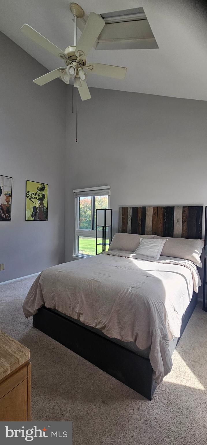 605 Augusta Circle Mount Laurel, NJ 08054 - Photo 25 of 28 a bedroom with a bed and a chandelier