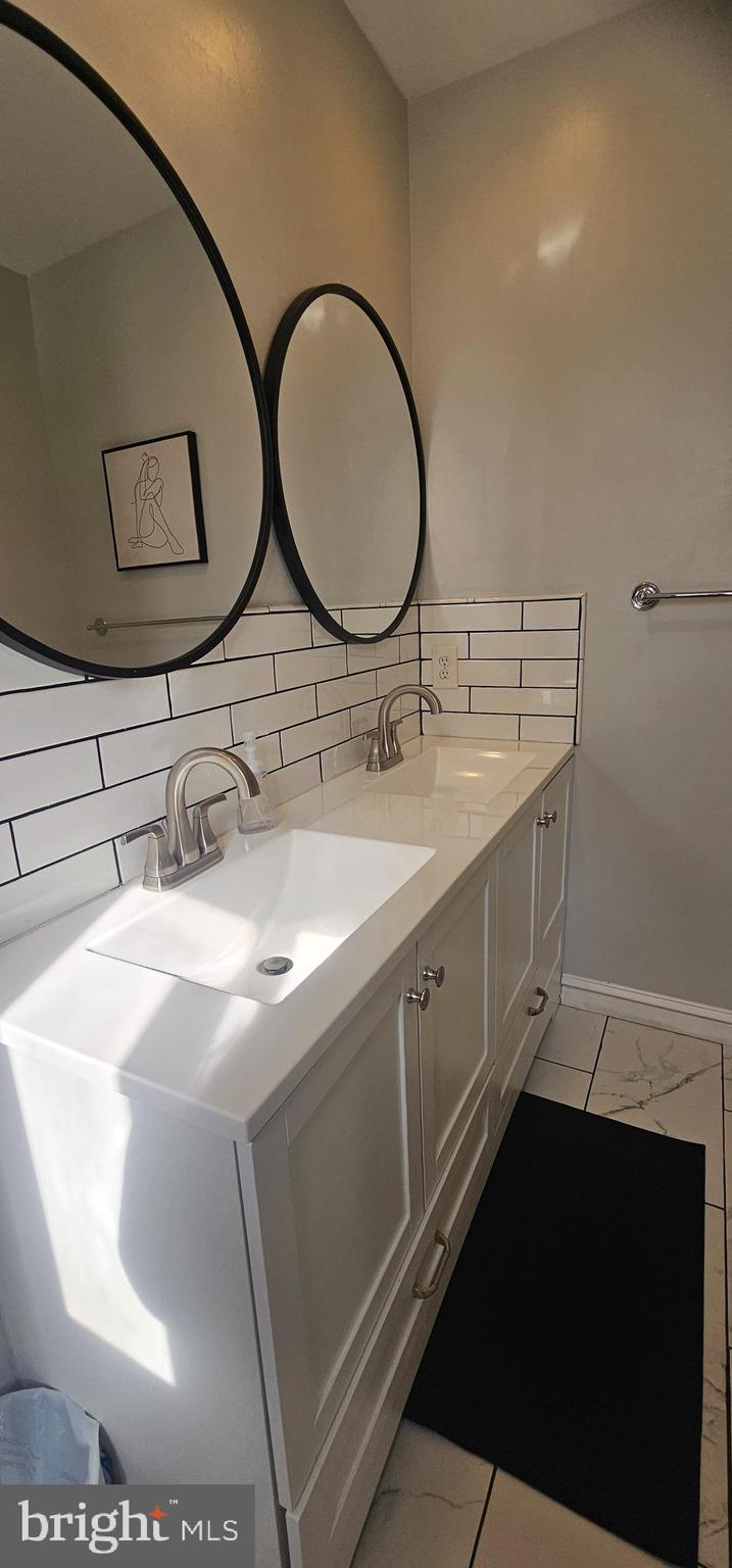 605 Augusta Circle Mount Laurel, NJ 08054 - Photo 26 of 28 a bathroom with a sink and a mirror