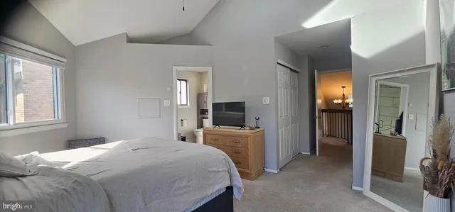 a bedroom with a bed and a television