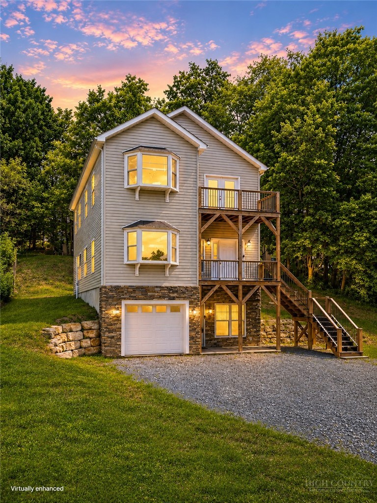 a view of a house with a yard