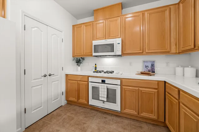 a kitchen with stainless steel appliances granite countertop cabinets and a sink