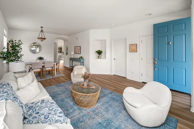 a living room with furniture and a table