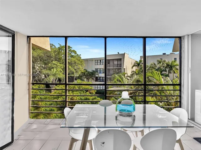 a spacious bedroom with a bed and a table