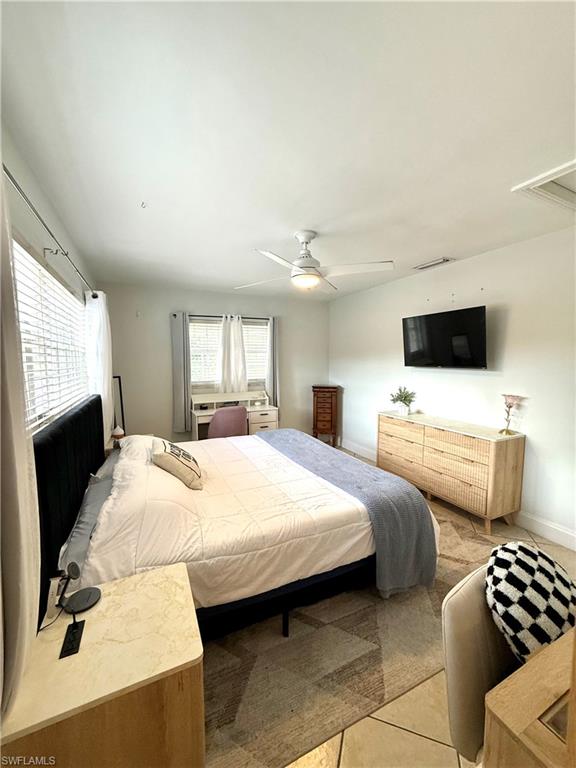 1964 42nd Street Southwest Naples, FL 34116 - Photo 11 of 25 a bedroom with bed and window