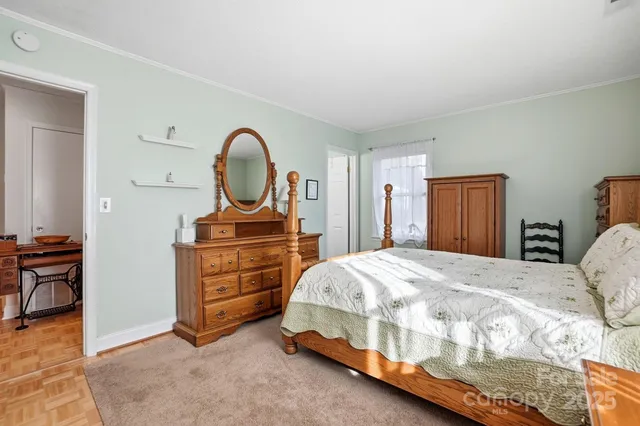 a bedroom with a bed and a dresser