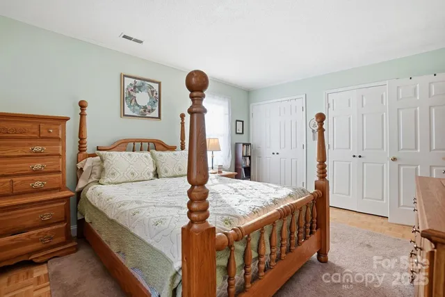 a bedroom with bed and a dresser