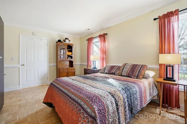 a bedroom with a large bed and a closet