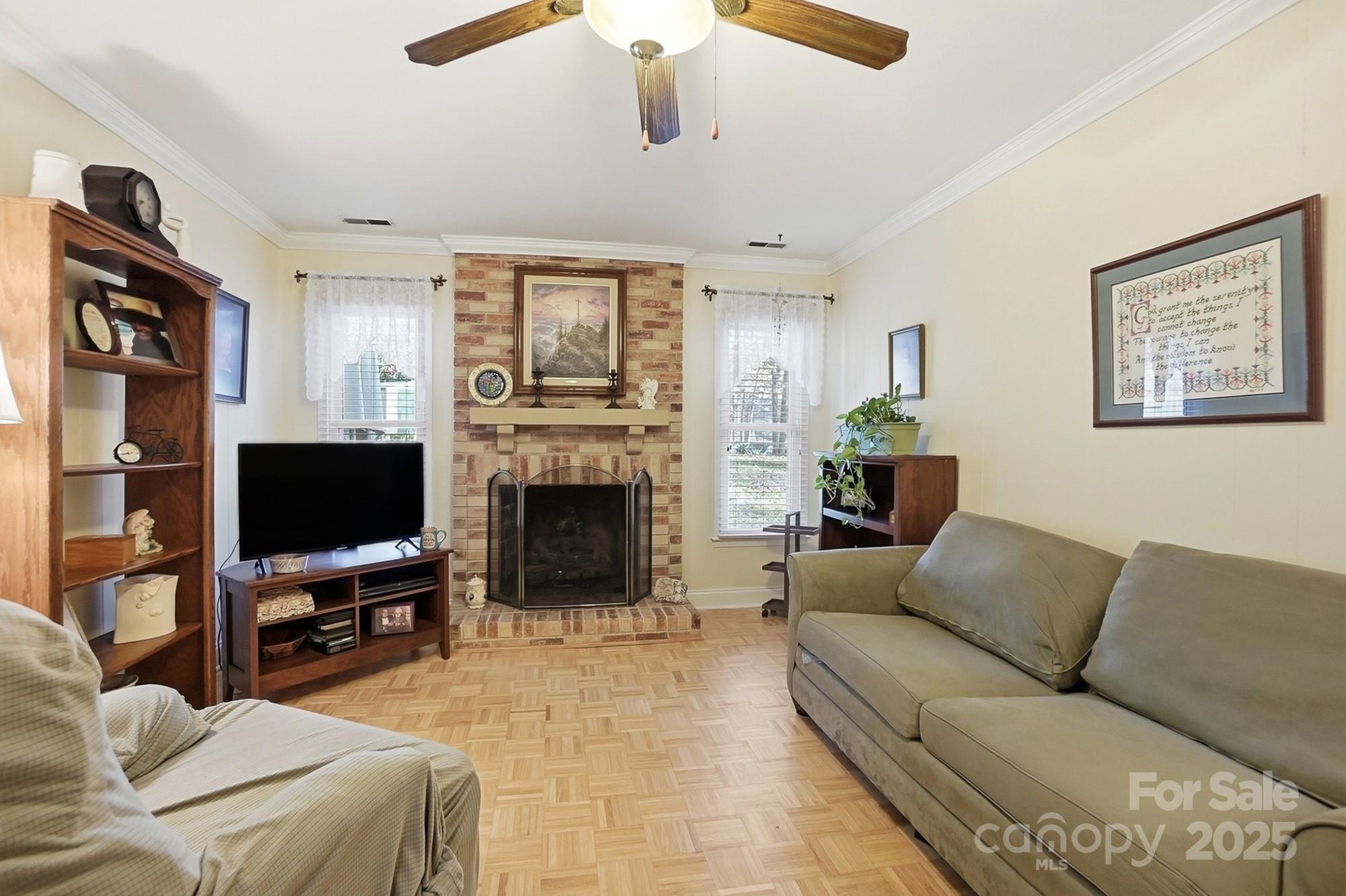 6309 Pineburr Road Charlotte, NC 28211 - Photo 36 of 46 a living room with furniture a fireplace and a flat screen tv