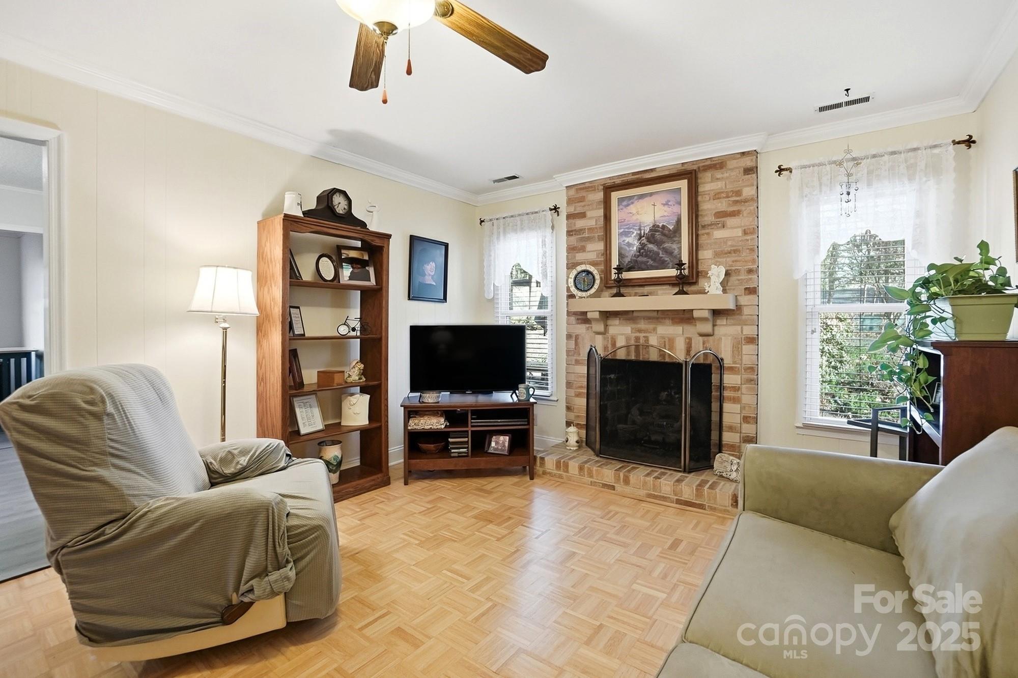 6309 Pineburr Road Charlotte, NC 28211 - Photo 37 of 46 a living room with furniture a flat screen tv and a fireplace