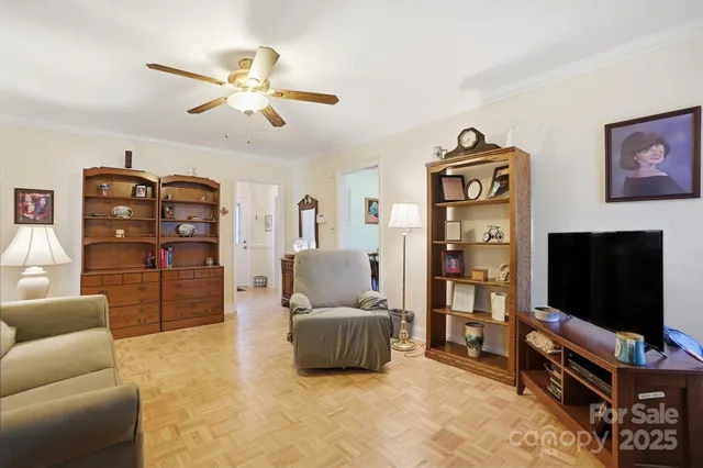 a kitchen with a sink cabinets and wooden floor