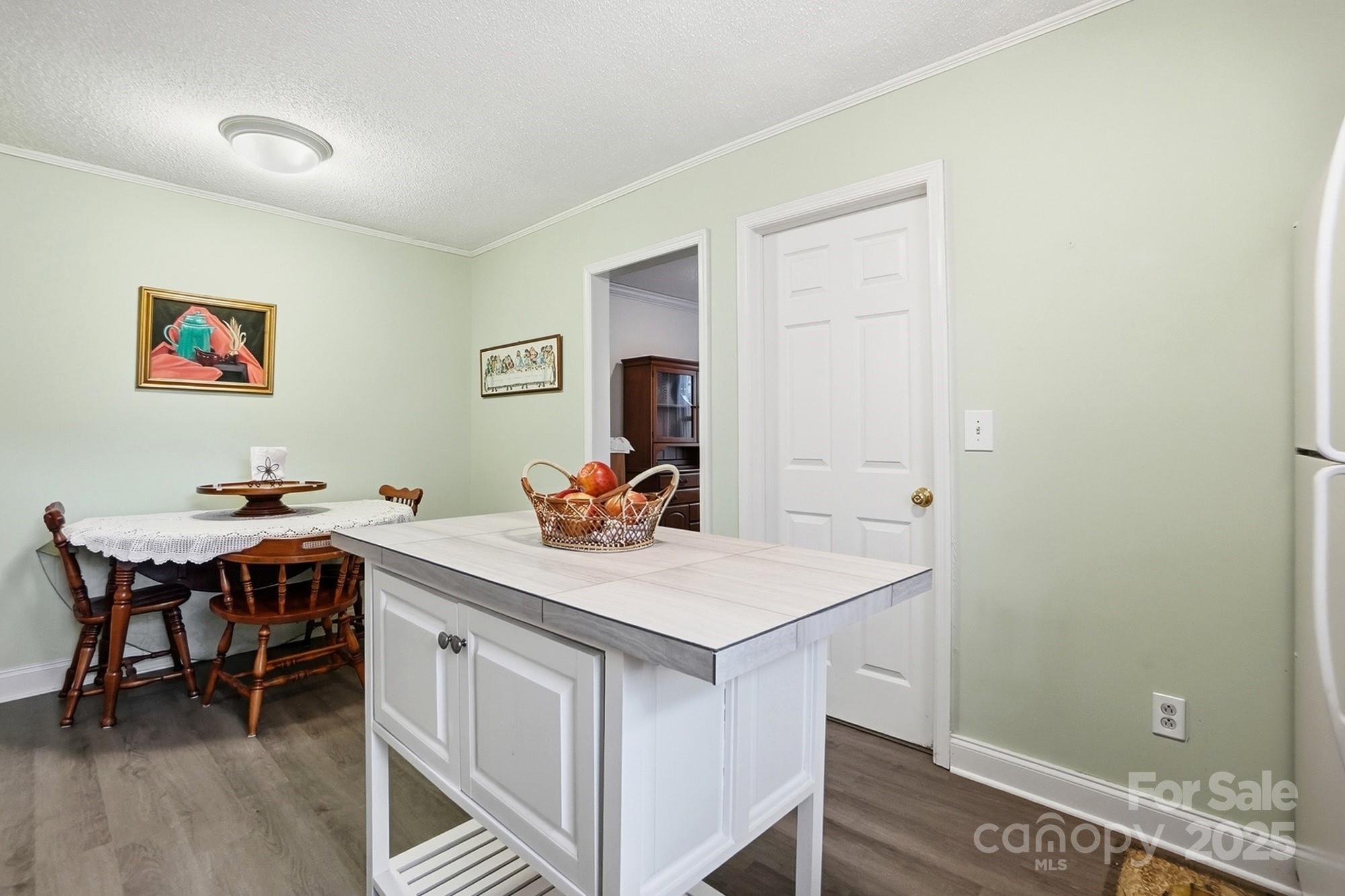 6309 Pineburr Road Charlotte, NC 28211 - Photo 43 of 46 a view of a kitchen area with furniture and wooden floor