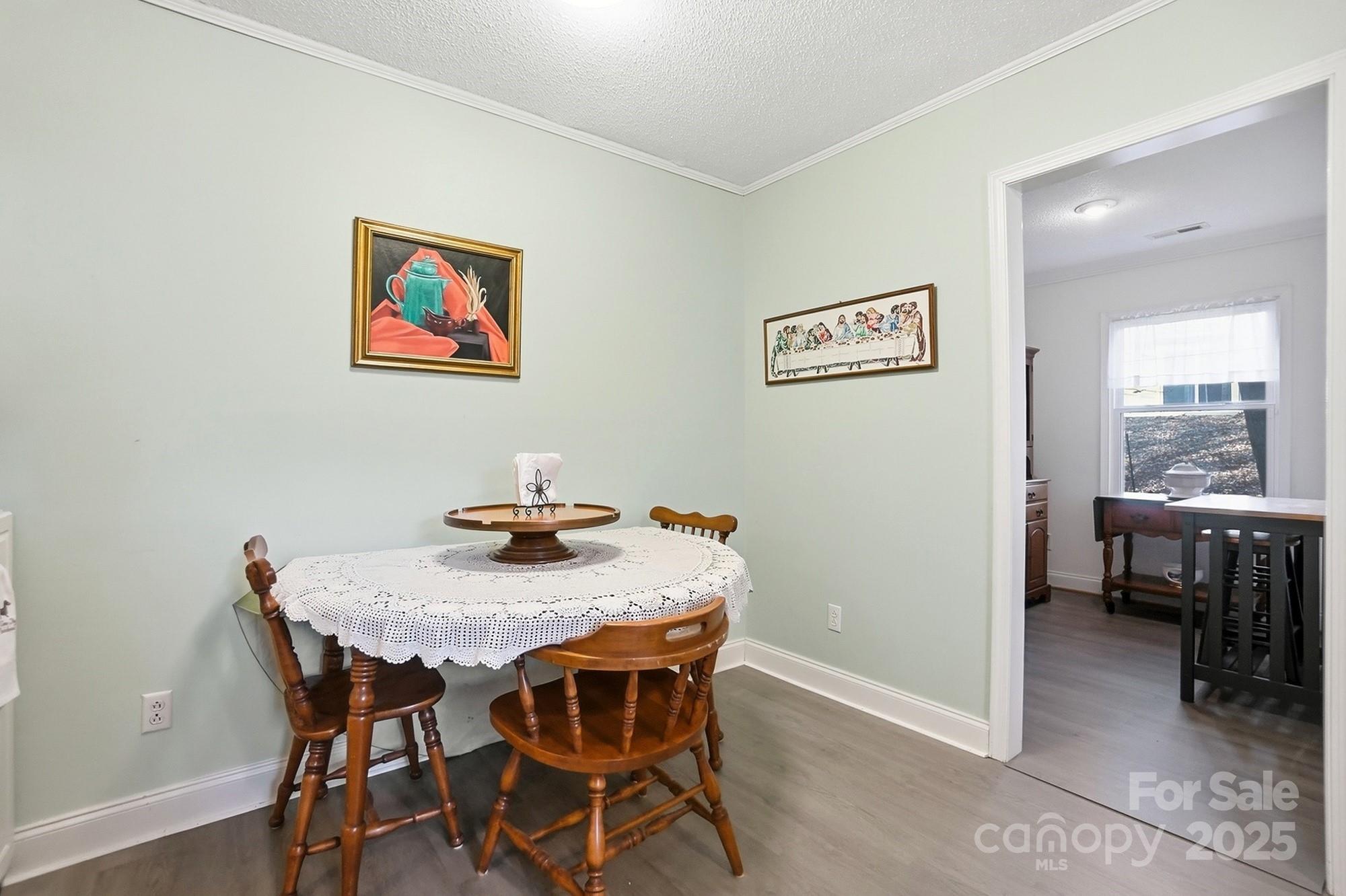 6309 Pineburr Road Charlotte, NC 28211 - Photo 44 of 46 a view of a dining area with furniture and a window