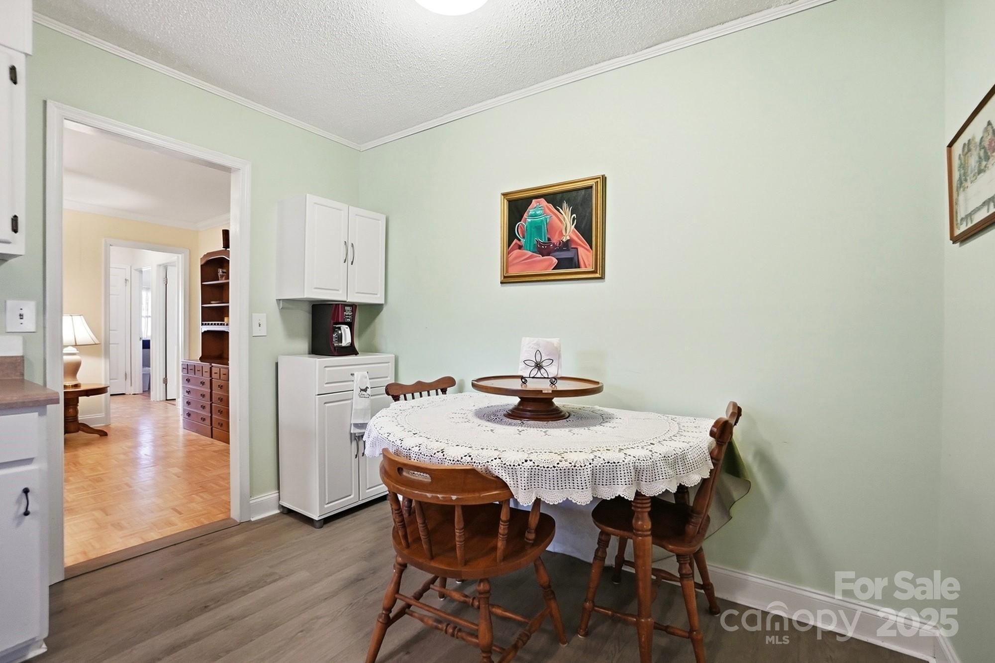 6309 Pineburr Road Charlotte, NC 28211 - Photo 45 of 46 a view of a dining room with furniture and wooden floor