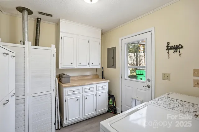 a kitchen with a refrigerator a sink and a window