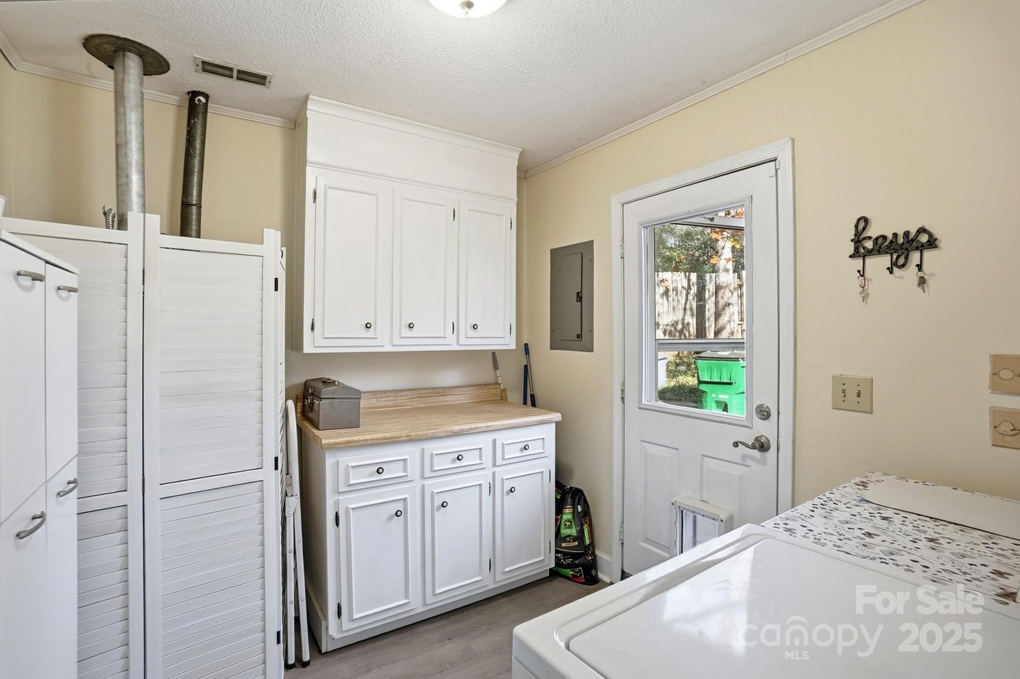 6309 Pineburr Road Charlotte, NC 28211 - Photo 7 of 46 a kitchen with a refrigerator a sink and a window