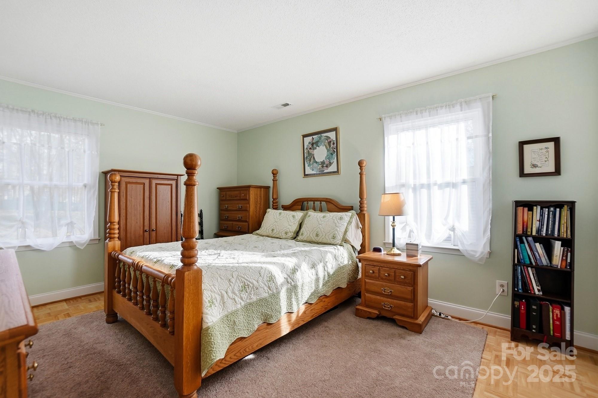 6309 Pineburr Road Charlotte, NC 28211 - Photo 10 of 46 a bedroom with a bed and a book shelf