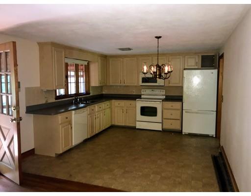 43 Cypress Road Natick, MA 01760 - Photo 4 of 8 a kitchen with kitchen island granite countertop a sink cabinets and stainless steel appliances
