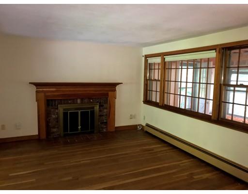 43 Cypress Road Natick, MA 01760 - Photo 5 of 8 a view of an empty room with wooden floor and a window