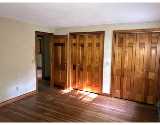 43 Cypress Road Natick, MA 01760 - Photo 6 of 8 an empty room with wooden floor and closet area