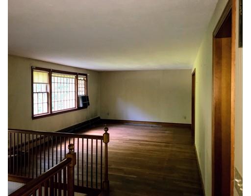 43 Cypress Road Natick, MA 01760 - Photo 7 of 8 a view of an empty room with wooden floor and a window