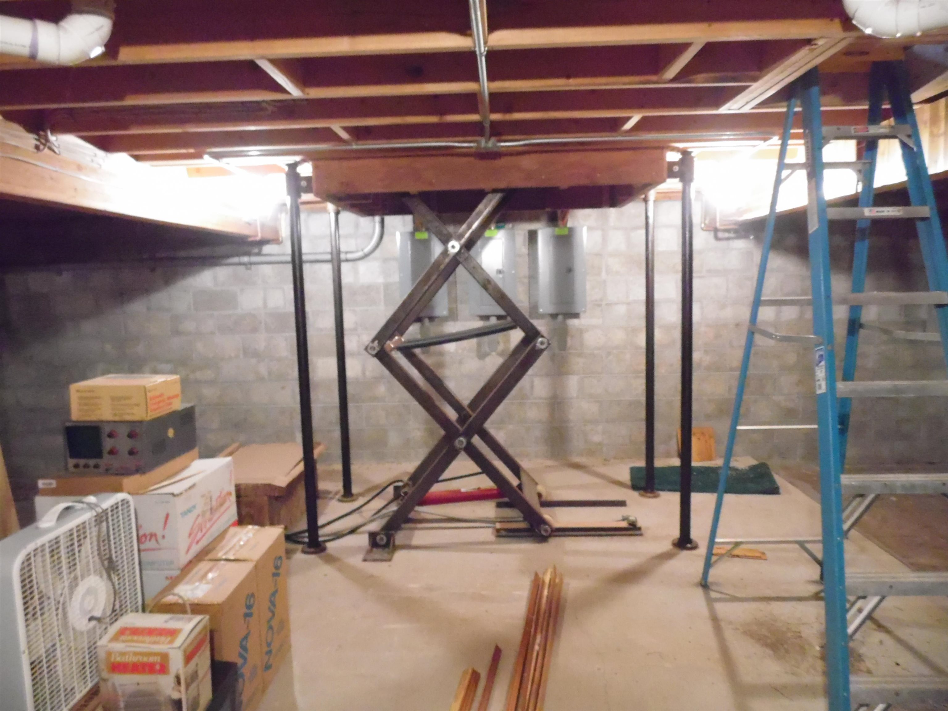 3646 Town Line Road Omer, MI 48749 - Photo 55 of 97 Hidden Elevator into basement.