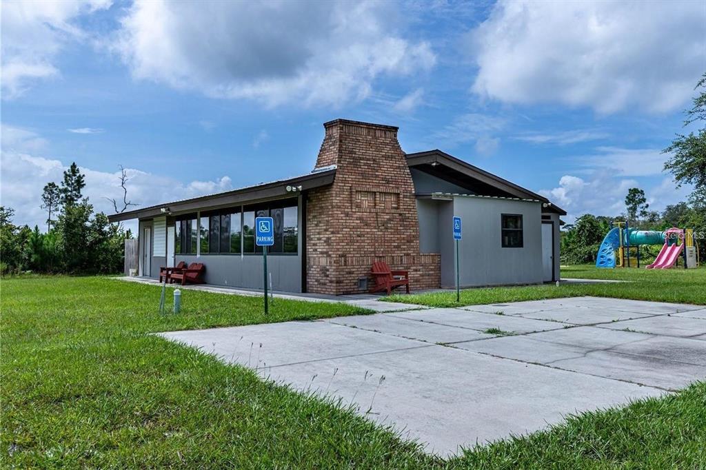 Apricot Avenue Eustis, FL 32736 - Photo 13 of 16 a front view of a house with a yard and garage
