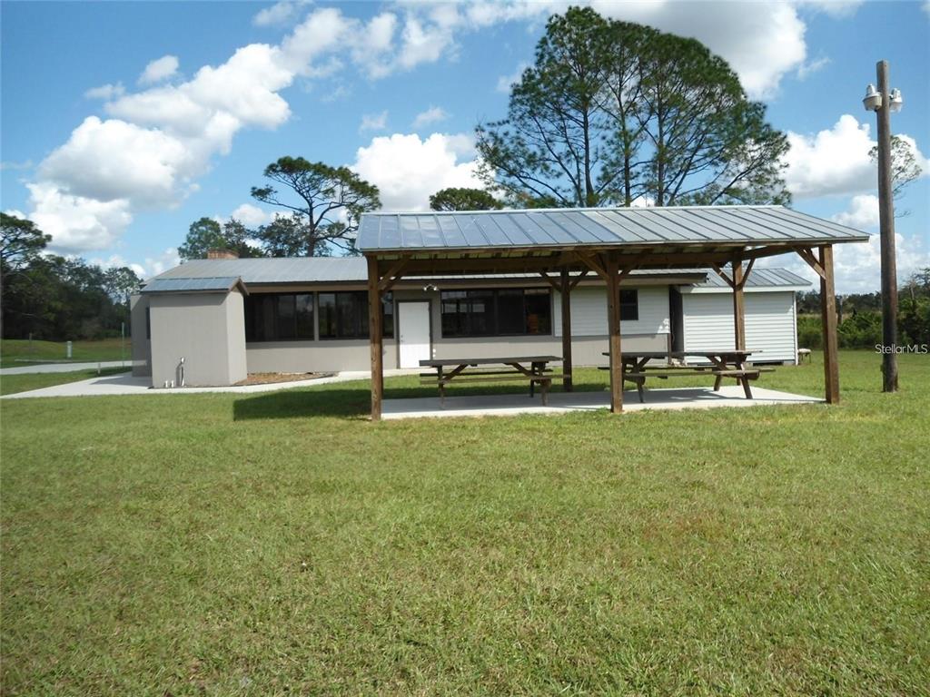 Apricot Avenue Eustis, FL 32736 - Photo 10 of 16 a front view of a house with a garden