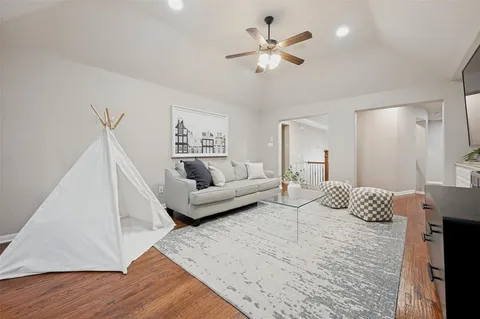 a bedroom with a large bed and a couch