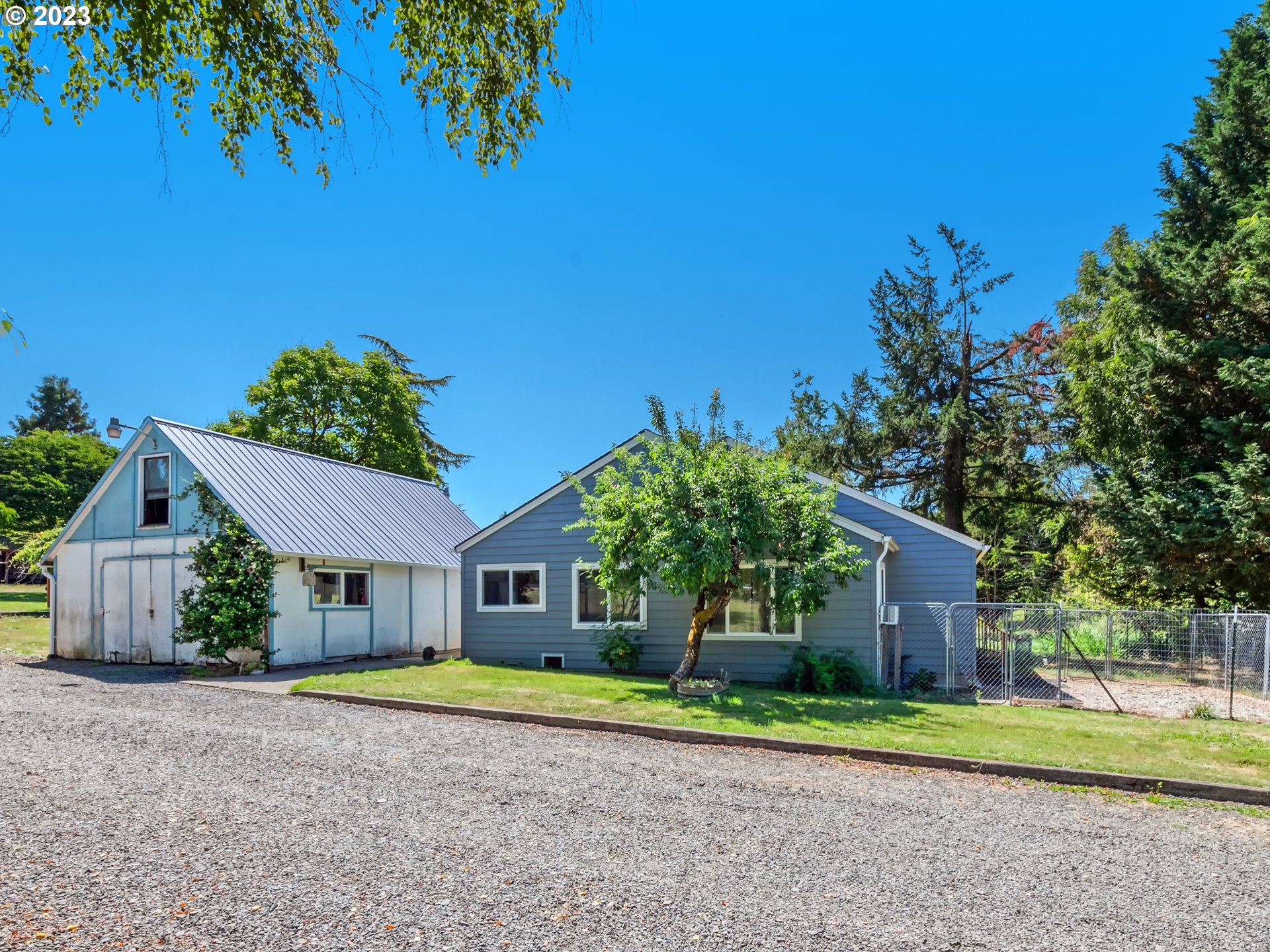 33955 Ford Mill Road Lebanon, OR 97355 - Photo 1 of 44 a front view of a house with a yard and garage