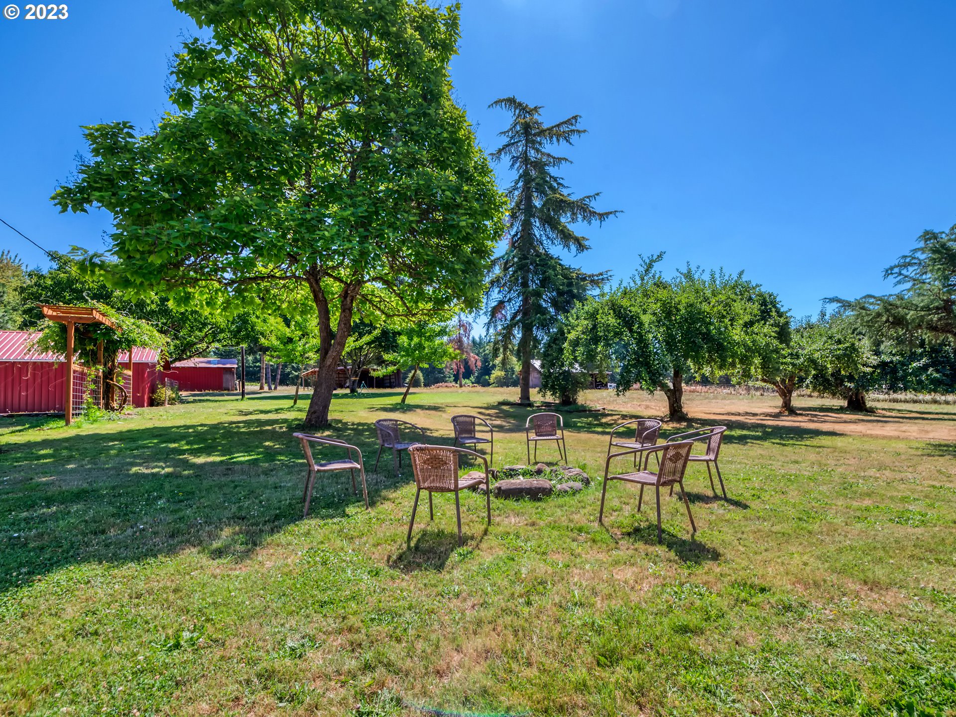 33955 Ford Mill Road Lebanon, OR 97355 - Photo 25 of 44 a backyard of a house with table and chairs