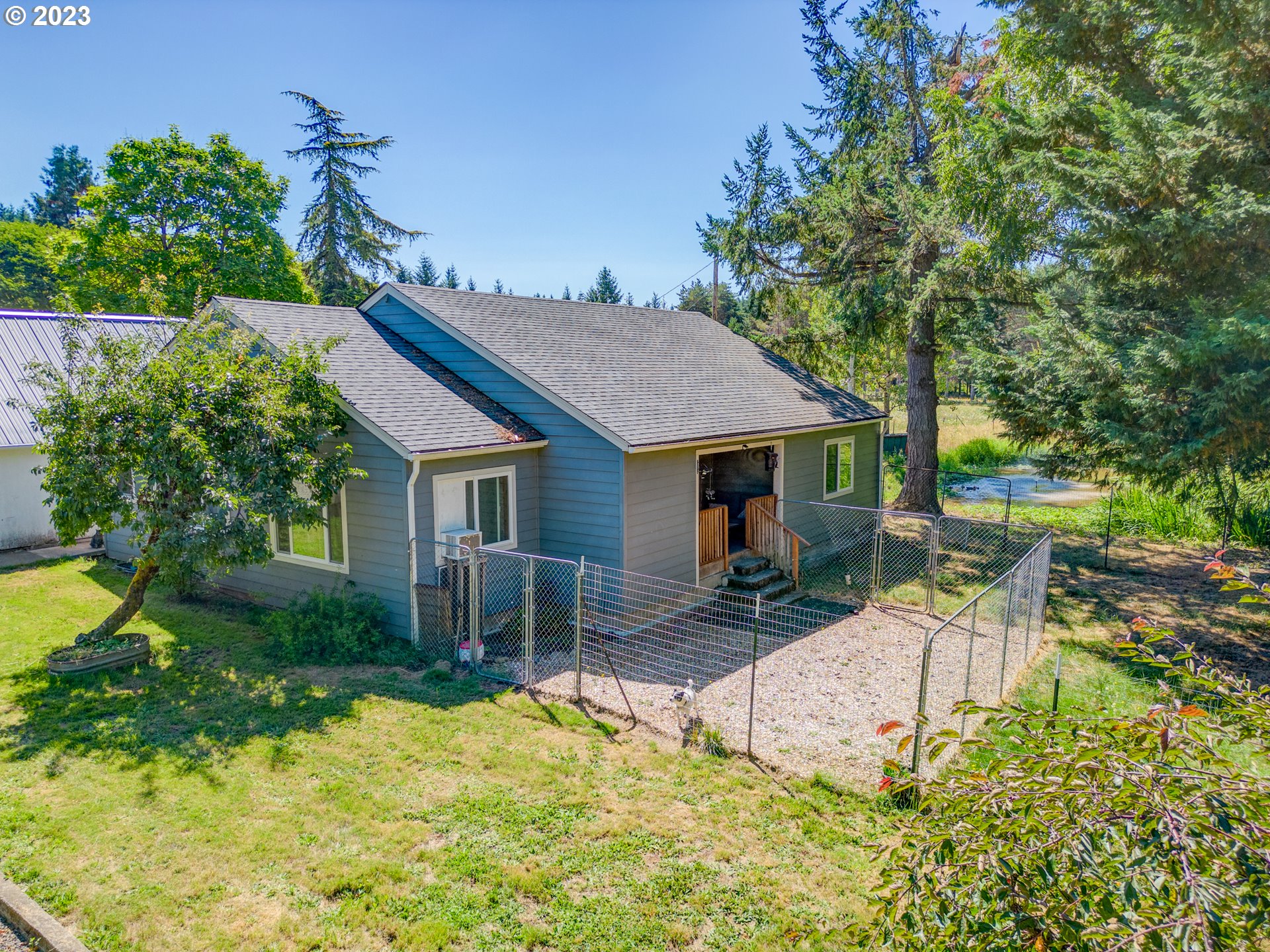 33955 Ford Mill Road Lebanon, OR 97355 - Photo 27 of 44 a view of a house with backyard and sitting area