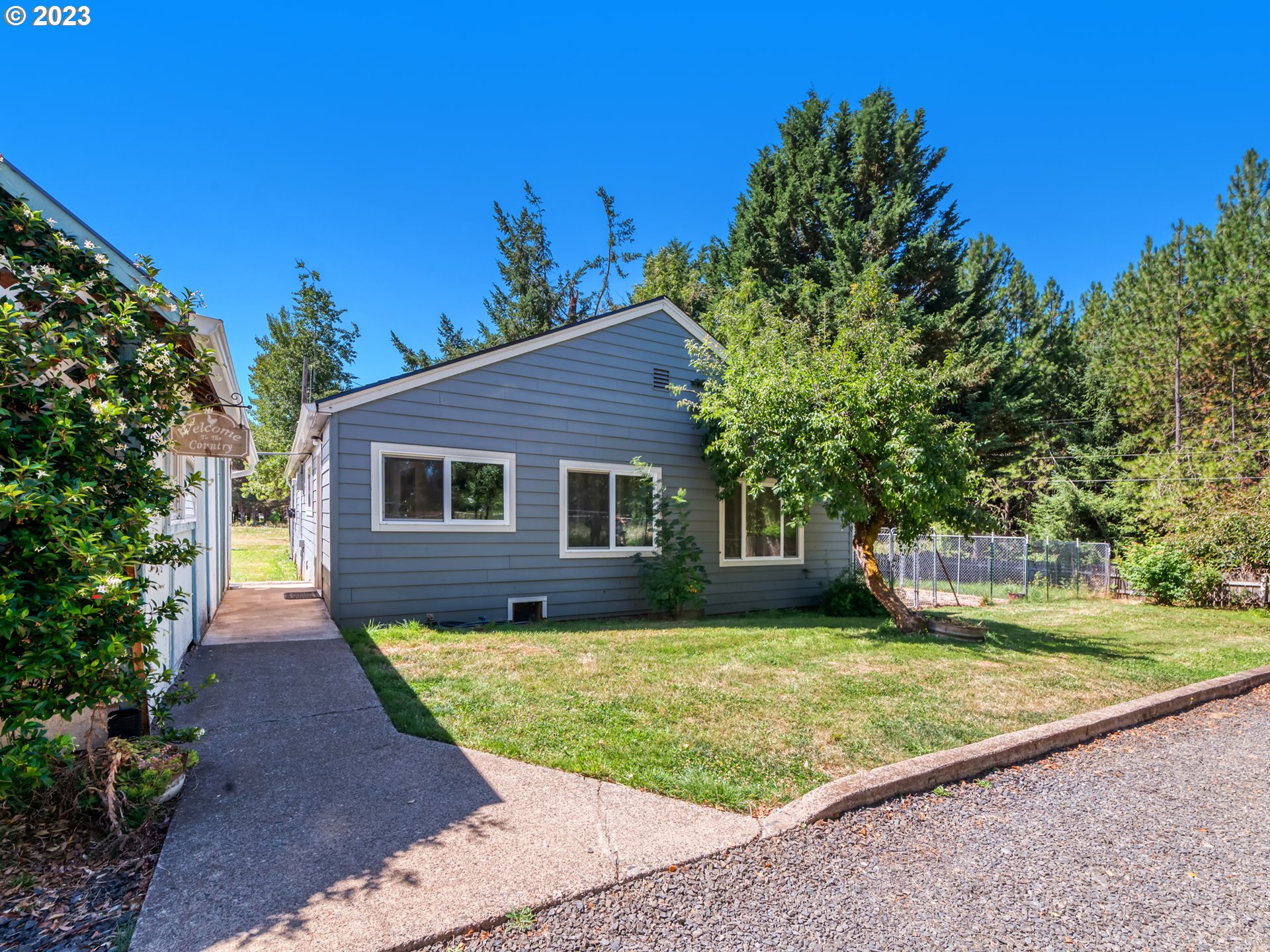 33955 Ford Mill Road Lebanon, OR 97355 - Photo 29 of 44 a front view of a house with a yard