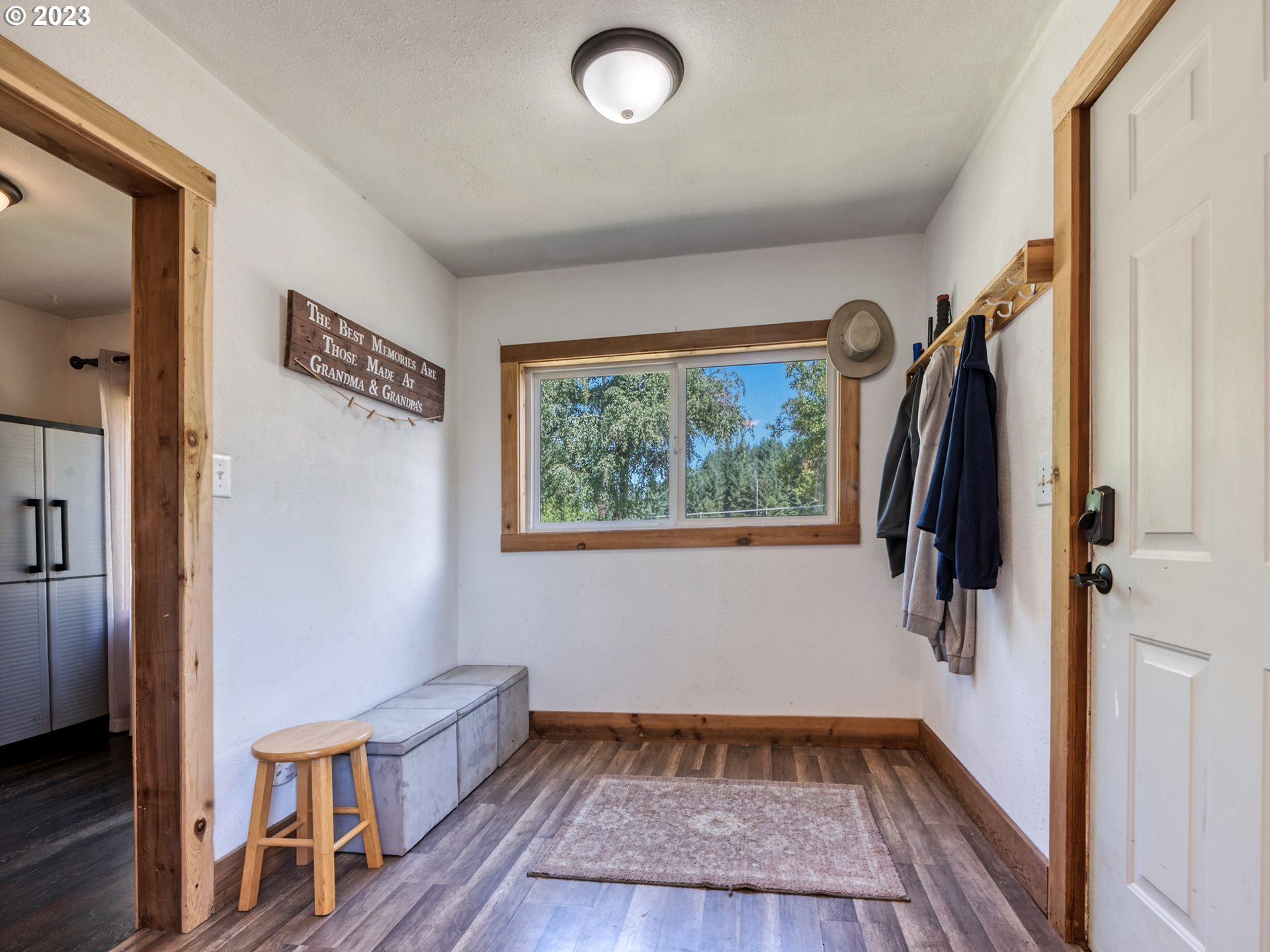 33955 Ford Mill Road Lebanon, OR 97355 - Photo 32 of 44 a view of hallway with a large window and wooden floor