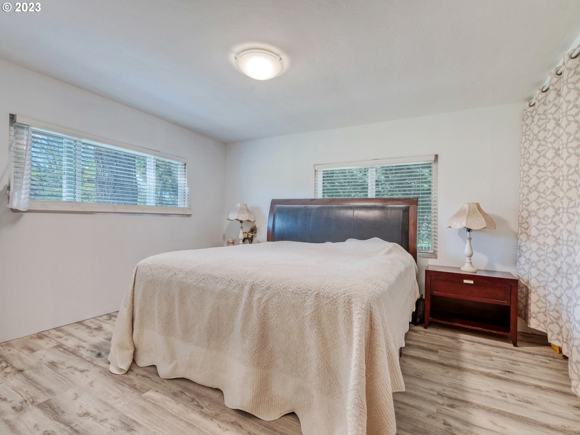 33955 Ford Mill Road Lebanon, OR 97355 - Photo 44 of 44 a bedroom with a bed and a night stand
