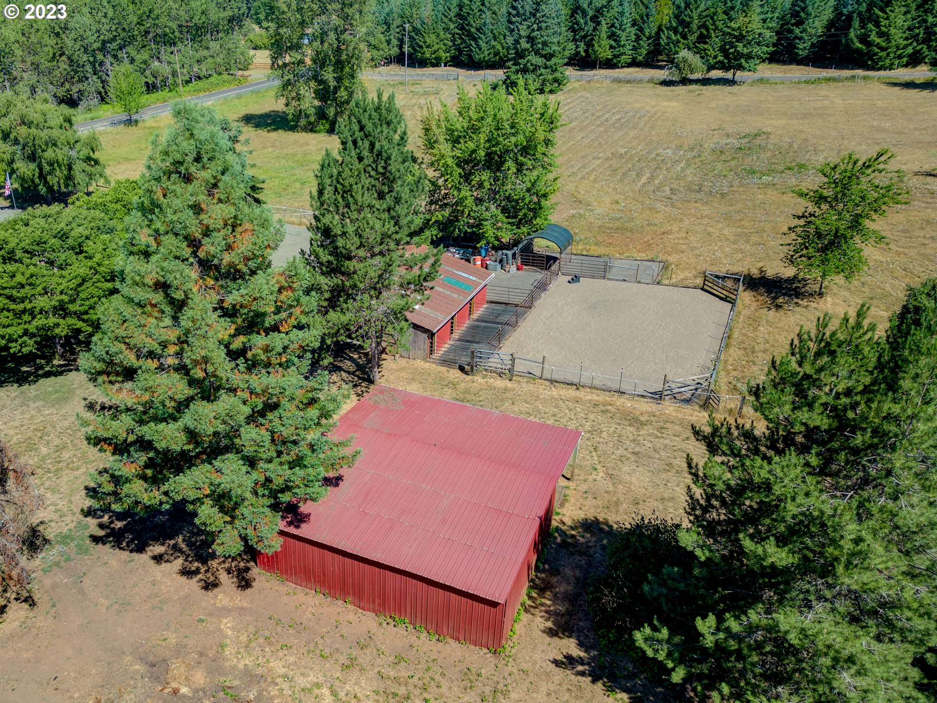 33955 Ford Mill Road Lebanon, OR 97355 - Photo 7 of 44 an aerial view of a house with a yard and pool