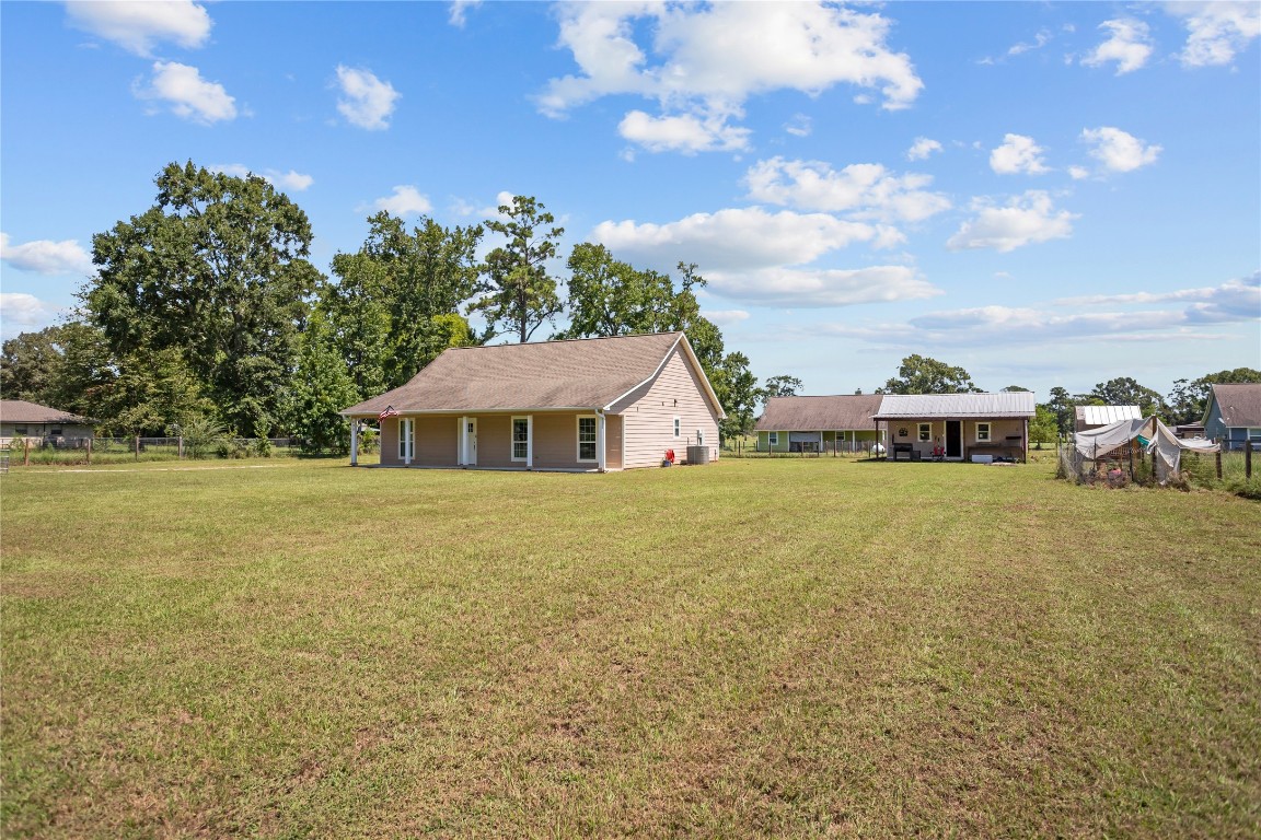 295 Garden City Road Livingston, TX 77351 - Photo 20 of 20 a front view of a house with a garden
