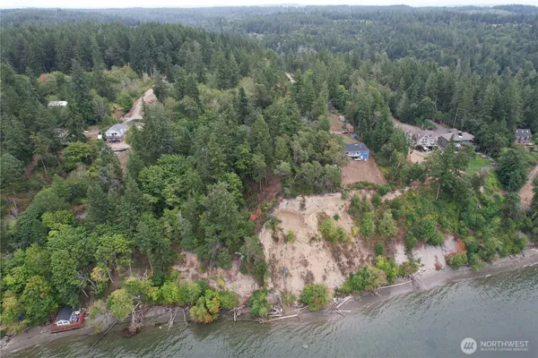 an aerial view of a house with a yard