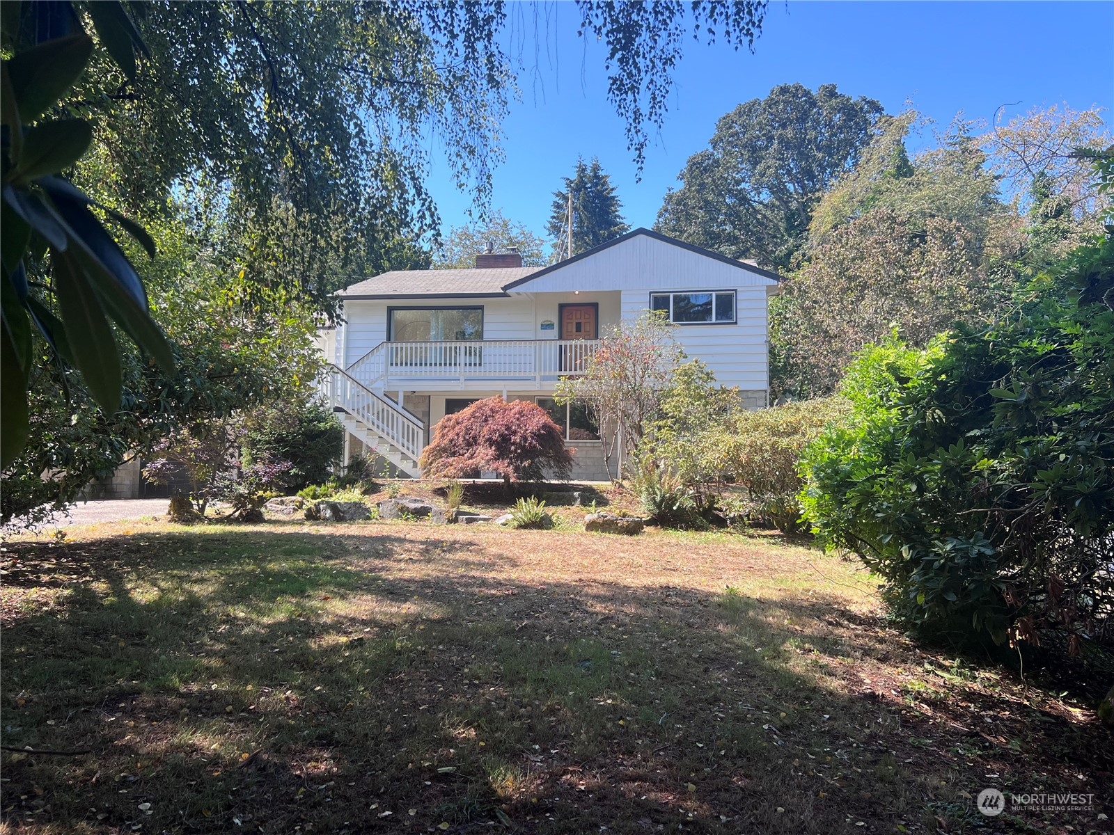 3102 Morrison Road West University Place, WA 98466 - Photo 1 of 36 a front view of a house with a yard and garage