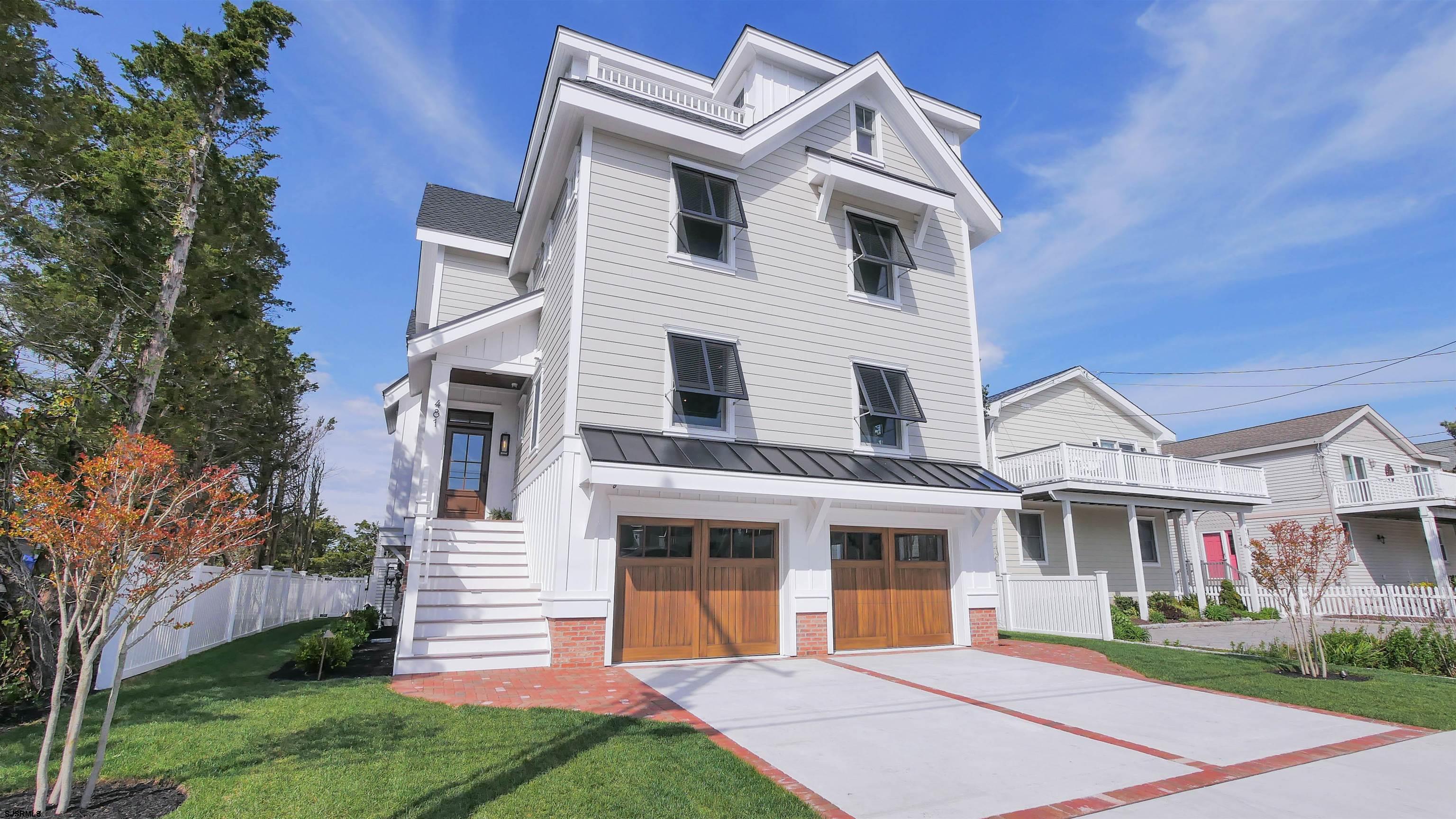 481 7th Street Avalon, NJ 08202 - Photo 1 of 51 a front view of a house with a yard