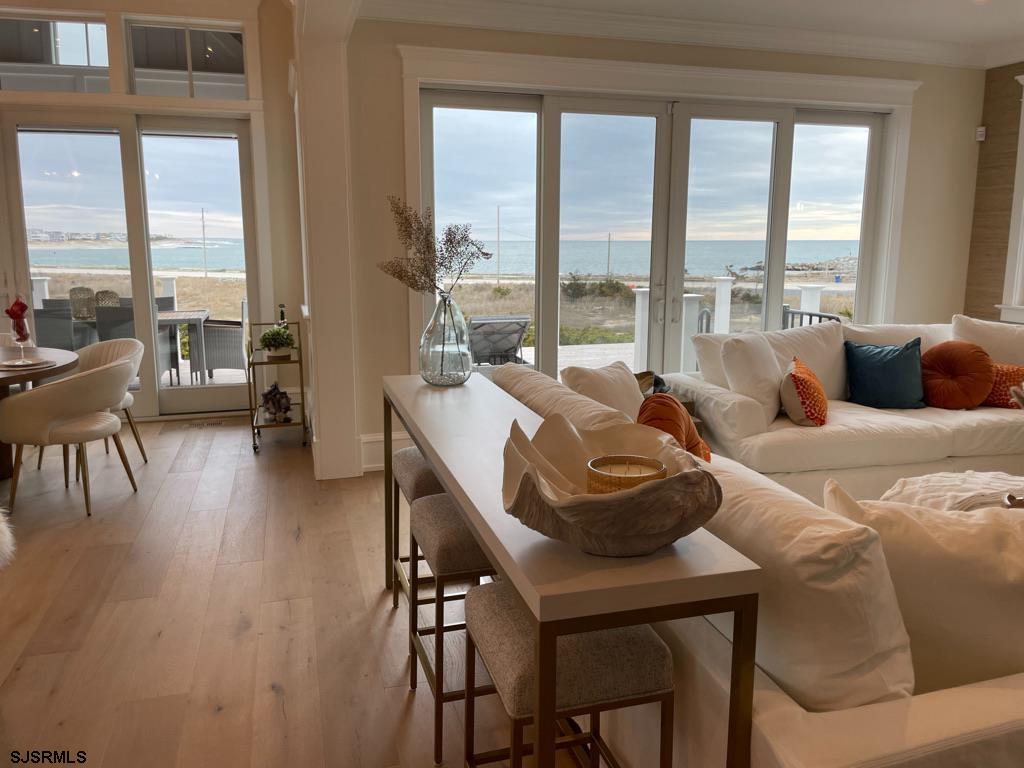 481 7th Street Avalon, NJ 08202 - Photo 13 of 51 a living room with furniture and floor to ceiling windows