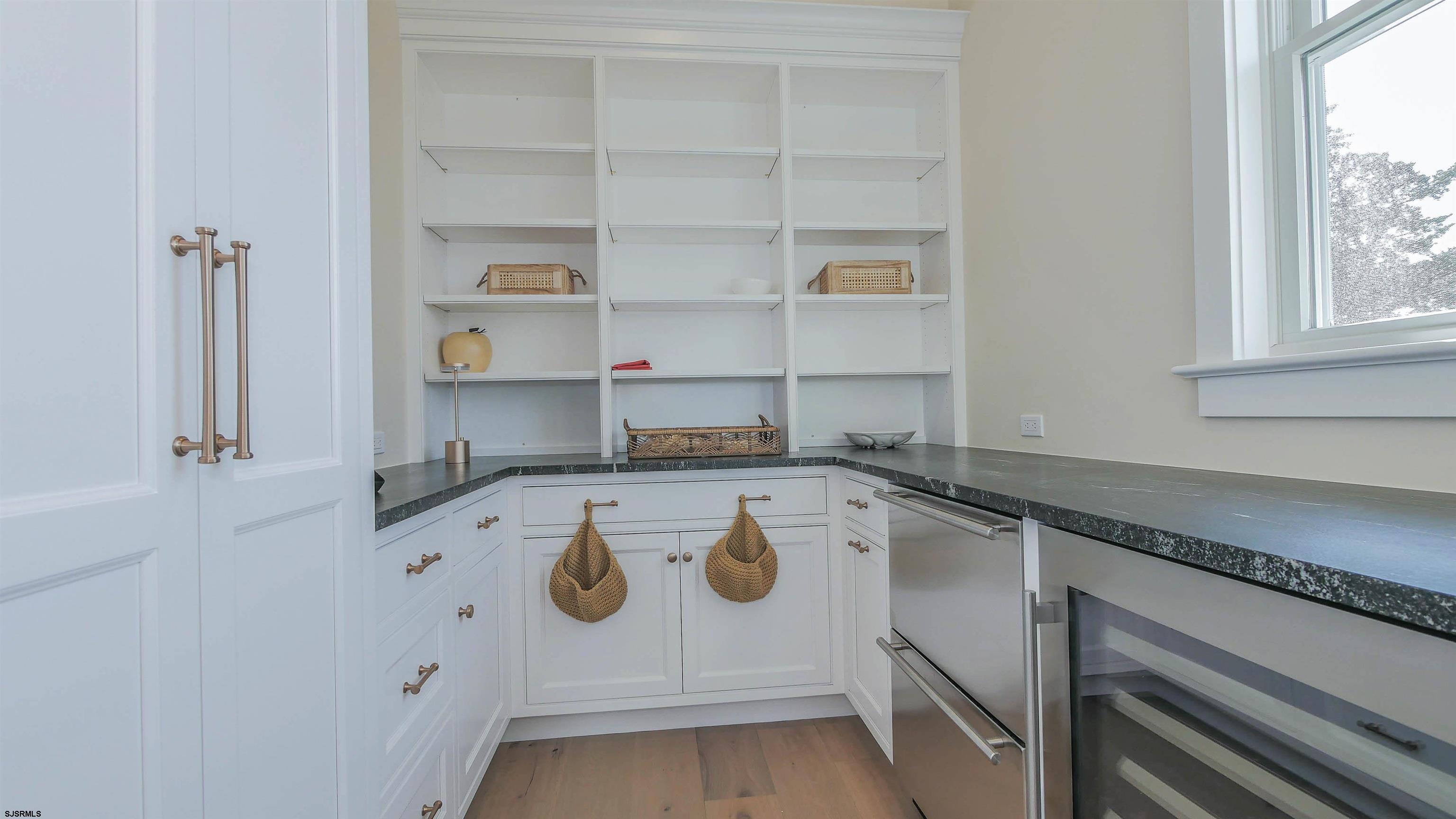 481 7th Street Avalon, NJ 08202 - Photo 16 of 51 a kitchen with a stove a refrigerator and a sink