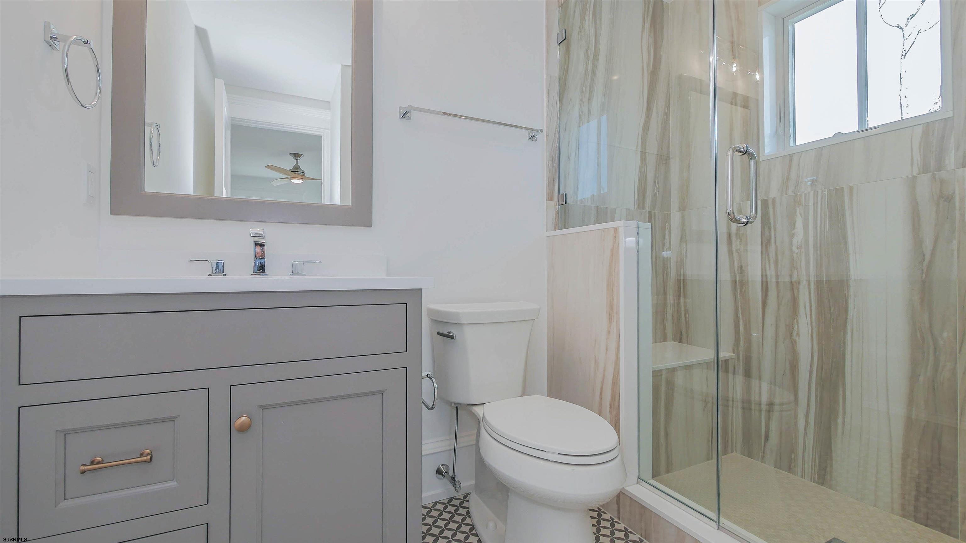 481 7th Street Avalon, NJ 08202 - Photo 29 of 51 a bathroom with a sink toilet and shower