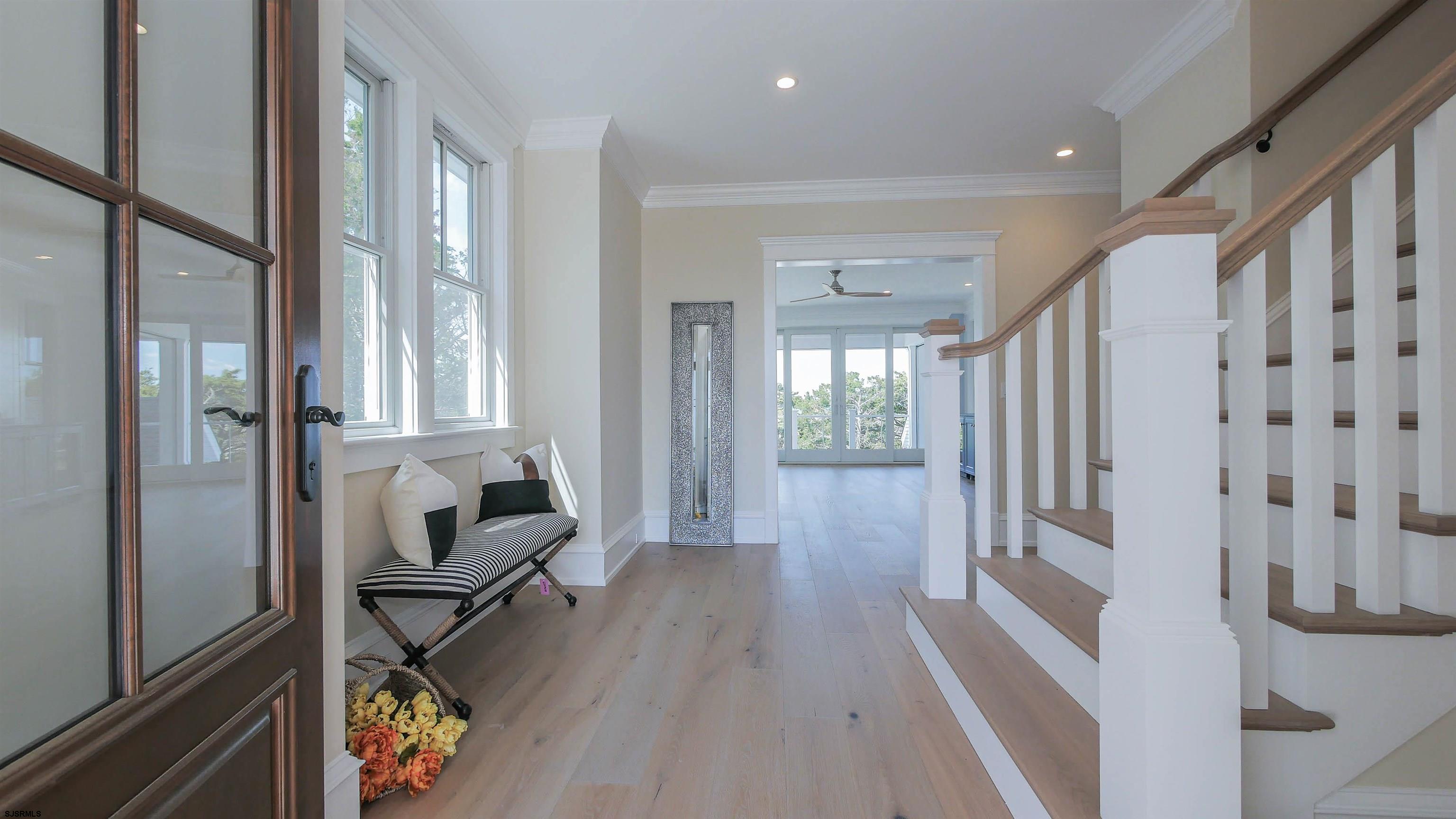 481 7th Street Avalon, NJ 08202 - Photo 3 of 51 a view of a hallway with wooden floor and dining room view