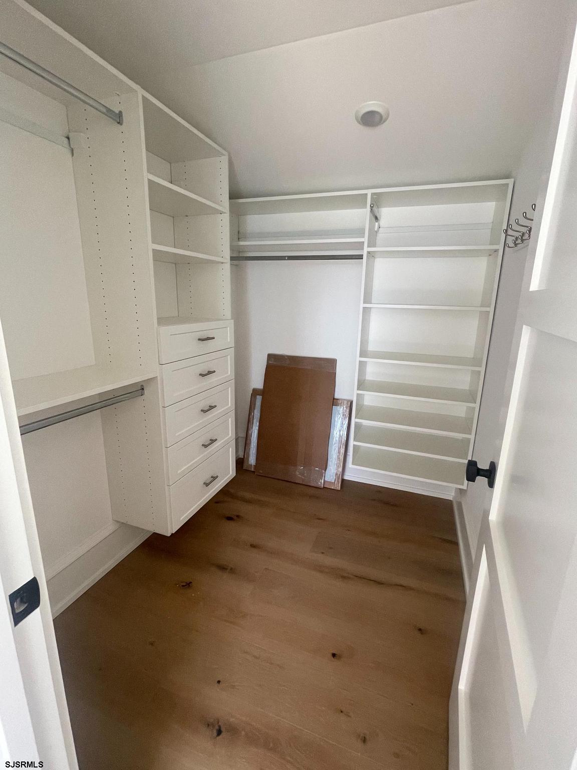 481 7th Street Avalon, NJ 08202 - Photo 40 of 51 a view of walk in closet with empty racks