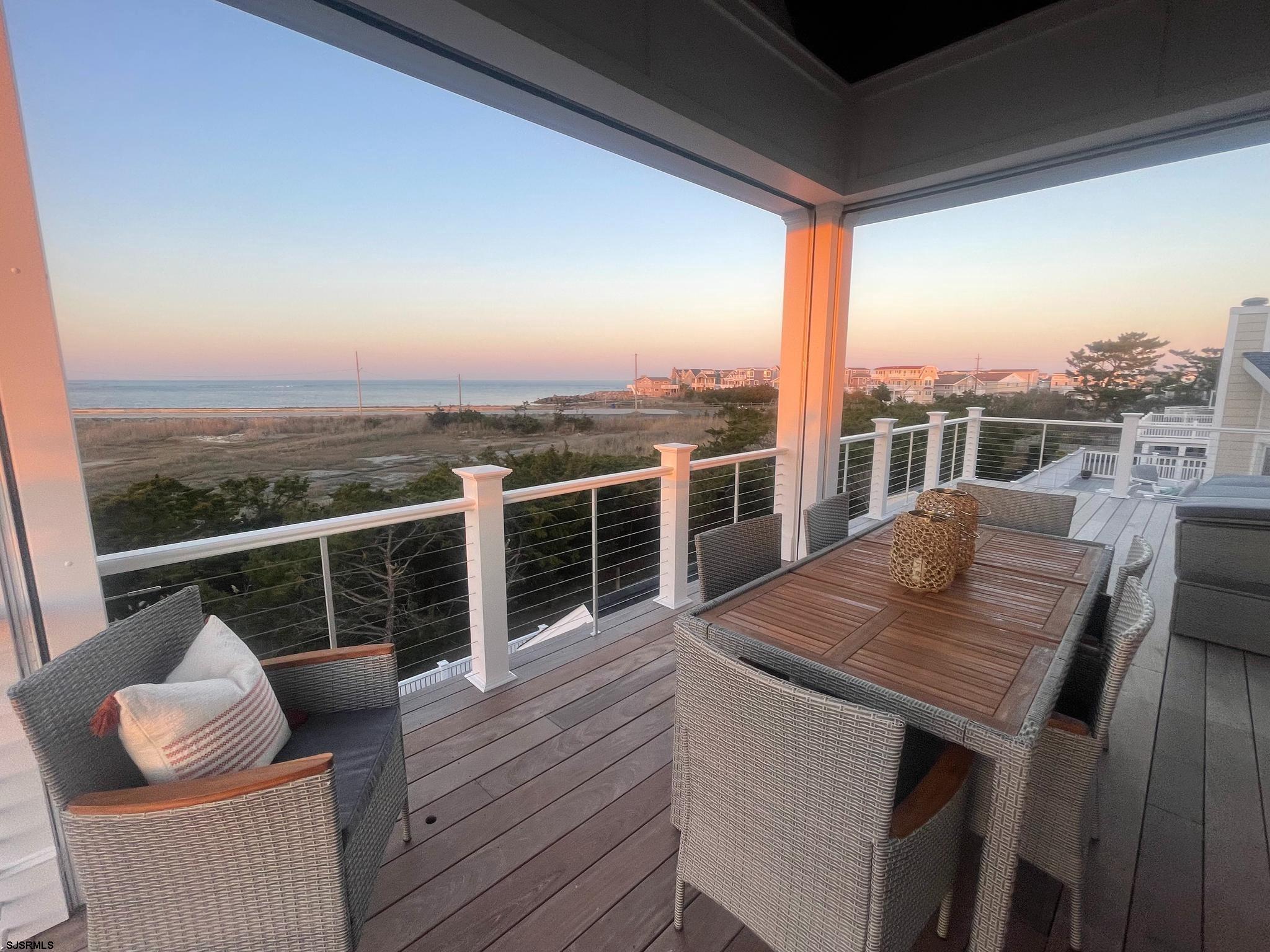 481 7th Street Avalon, NJ 08202 - Photo 4 of 51 a view of a balcony with table and chairs